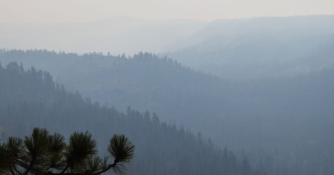 Wildfire smoke in a mountain valley