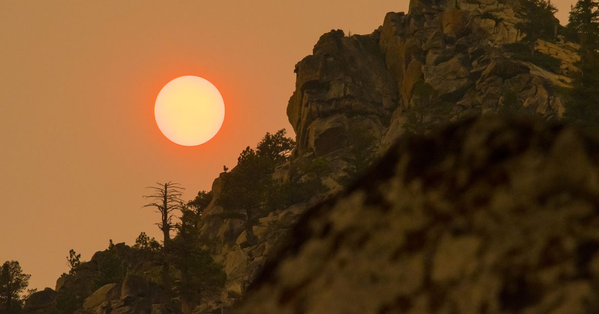 Wildfire smoke and haze turning the sun red