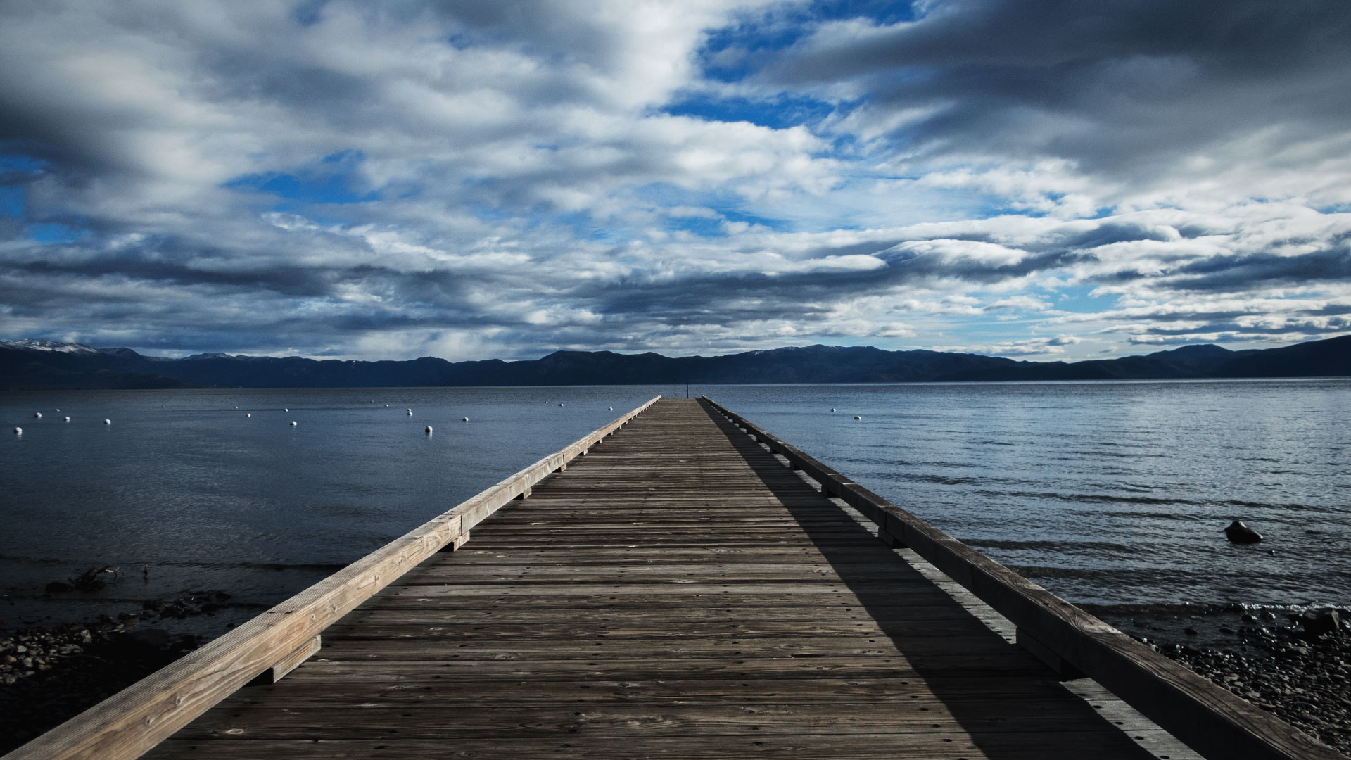 Pier on Lake Tahoe with dramatic clouds overhead